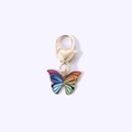 Rainbow gradient enamel butterfly keychain with golden heart clasp on white background - Colorful Butterfly