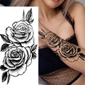 Black and white sketch rose flower tattoo sticker shown on a model arm skin - Pattern BK-031