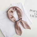 Elegant dusty pink silk square scarf tied in a knot on a white T-shirt - Khaki