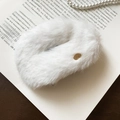 Detail of white plush faux fur hair clip with gold metal tag on a vintage book - Duckbill Hair Clips / White