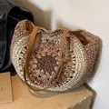 Handwoven straw tote with multi-color radial patterns and brown leather straps - Coffee