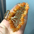 Detail of a golden alloy butterfly hair claw clip with orange crystal stone beads - Red Aventurine Gold Butterfly