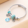 Bracciale a spirale argento con ciondoli a farfalla blu e pietre di zircone cubico - Verde