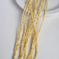Strands of cream yellow flat heishi shell beads for DIY jewelry making and necklaces - 3mm / Light Yellow