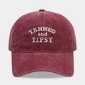 Close-up of white TANNED and TIPSY letter embroidery on washed wine red cotton baseball cap - Adjustable / TANNED and TIPSY / Burgundy