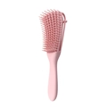 Detailed close-up of a pink vented detangling hairbrush with flexible plastic bristles - Girl Pink