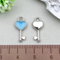Blue enamel heart key charm in silver alloy with measurement scale reference - Blue Heart Key 7x16mm