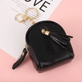 Miniature black litchi leather backpack coin purse with gold keychain and tassel detail - Black