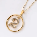 Detail view of gold-tone necklace featuring an S-letter pendant with micro-set crystals - Gold Number 2
