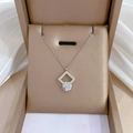 Macro shot of a square geometric pendant with zircon in a jewelry box on white fabric - K520 Silver [full Body Titanium Steel]