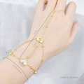 Golden hand chain bracelet with heart-shaped shell charm and adjustable beaded links - Heart