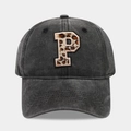 Close-up of washed denim baseball cap with leopard print letter P embroidery - Letter P