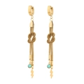 Detail of gold dangle earrings featuring turquoise beads and lightning bolt pendants - Gold Woven Knot Lightning Bolt Turquoise Drop Earrings