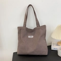Brown canvas tote bag with fashion instinct label for daily shoulder or hand carry use - Gray