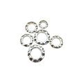 Macro detail of six Tibetan silver alloy spacers with hammered texture for DIY jewelry - Diameter 6mm / Antique Silver
