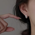 Minimalist S925 sterling silver hoop earring with brushed matte finish on a model ear - 15mm / Silver