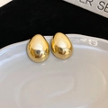 Minimalist gold oval stud earrings with high-polish metallic finish on a ceramic tray - Gold Circular Stud Earrings (64#) / Gold