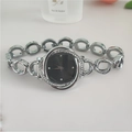 Detail view of silver floral diamond-encrusted bezel with minimalist black dial watch - Silver Band Black Dial