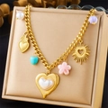 Detail view of a chunky gold chain necklace with colorful heart and flower charms - Pearl Heart Flower Shell (N3169)