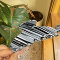 Detail of large zebra stripe acetate claw clip with thick teeth for secure hair styling - Large