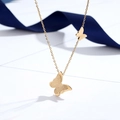 Elegant 18K gold butterfly necklace with matte and polished texture on silk background - Double Butterfly Necklace / Gold
