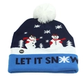Detail of blue knitted Christmas hat with LET IT SNOW text and functional LED power button - One Size / Blue White Let it Snow (LED)