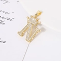 Detailed view of a gold-plated crown letter N pendant with sparkling zircon stones - Letter N