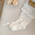 White Lolita crew socks with ruffle trim and bow detail on a brunch style background - One Size / Pure White