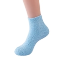 Fuffy light blue coral fleece slipper socks shown on model for a cozy fit - Sky Blue