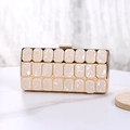 Detail of white pearlescent acrylic clutch with gold frame and square metal clasp - 3-Row Style (Small) / Champagne