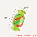 Green resin candy charm with red stripes and gold sequins, 30mm x 14mm size reference - Green Striped Candy