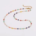 Close-up of golden necklace with colorful square beads and lobster clasp detail - Necklace
