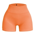 Orange high-waisted seamless ribbed workout shorts with peach lift effect in size small - Light Orange
