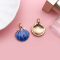 Deep blue shell pendant with golden edges and radial texture on a soft pink background - Blue Large Shell 20x26mm