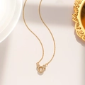 Macro detail of gold Mickey pendant with sparkling cubic zirconia on delicate chain - Floating Mickey Style (8933) / Gold