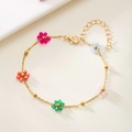 Minimalist gold chain bracelet featuring colorful beaded flower charms and lobster clasp - Colorful Beaded Flower / Gold