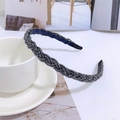 Detail of beaded braided headband in grey with navy lining next to a coffee cup - Navy Blue