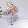 Sparkly resin letter P keychain with purple sequins, tassels and golden lobster clasp - Letter P