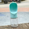 Portable pet water bottle with mint green bowl and transparent body on wooden bench - 330ml-With Lock / Blue