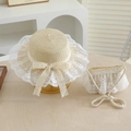 Close-up of summer straw sun hat and lace bag set with white bow on wooden surface - 52cm 2-5 Years Old / Beige Set