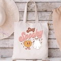 Off-white canvas tote bag featuring Stay Spooky pumpkin and ghost Halloween print - Stay Spooky Pumpkin Ghost Combo