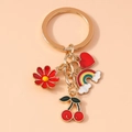Llavero de cerezas y arcoíris con baño de oro y colgantes de esmalte suave - Flor de Cerezo