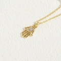 Gold Hamsa Hand necklace with shimmering heart-shaped zircon inlay on a fine link chain - Heart Hamsa Hand / 14K Gold Color