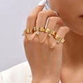Close-up of gold star and butterfly sequin rings connected by chains and rhinestones - Four-Finger Linked Style (R537_2)