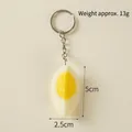 Realistic PVC boiled egg keychain with detailed yellow yolk and white resin pendant - 1/4 Hard-boiled Egg - Silver Ring