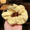Pale yellow ribbed knit scrunchie with soft elastic texture for a high ponytail - Artistic Girl Cream Yellow