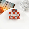 Detail of a 5cm square checkered hair claw clip with red and blue patterns on white plate - 5cm Square Block / Red and Blue Checkerboard