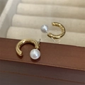 Elegant C-shaped golden hoop earrings with white pearl accents on wooden jewelry box - Plain Gold C-Shaped Pearl Studs
