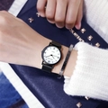 Minimalist quartz watch with white dial and black strap paired with a silver cuff bracelet - Small Size - Roman White Dial