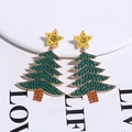 Close-up of Christmas tree earrings with green rhinestones, yellow stars and pearl beads - Green Christmas Tree With Star Top